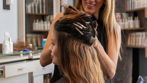 Woman with long, voluminous semi-permanent hair extensions