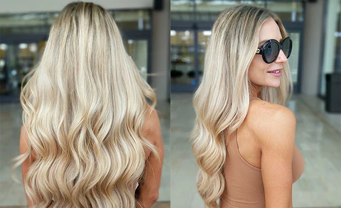 Smiling woman with long, voluminous hair extensions