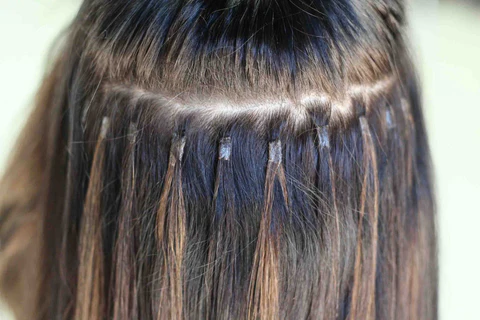 Keratin fusion hair extensions attached to natural hair
