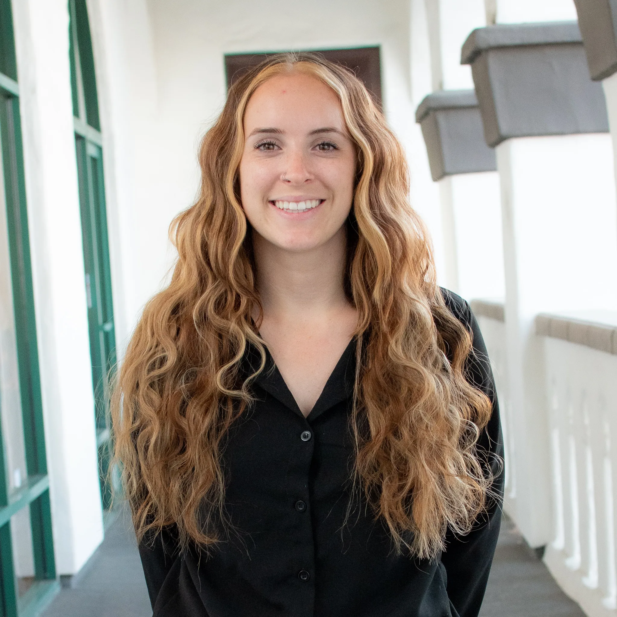 Final result of long wavy weft hair extensions with added volume, length, and natural movement