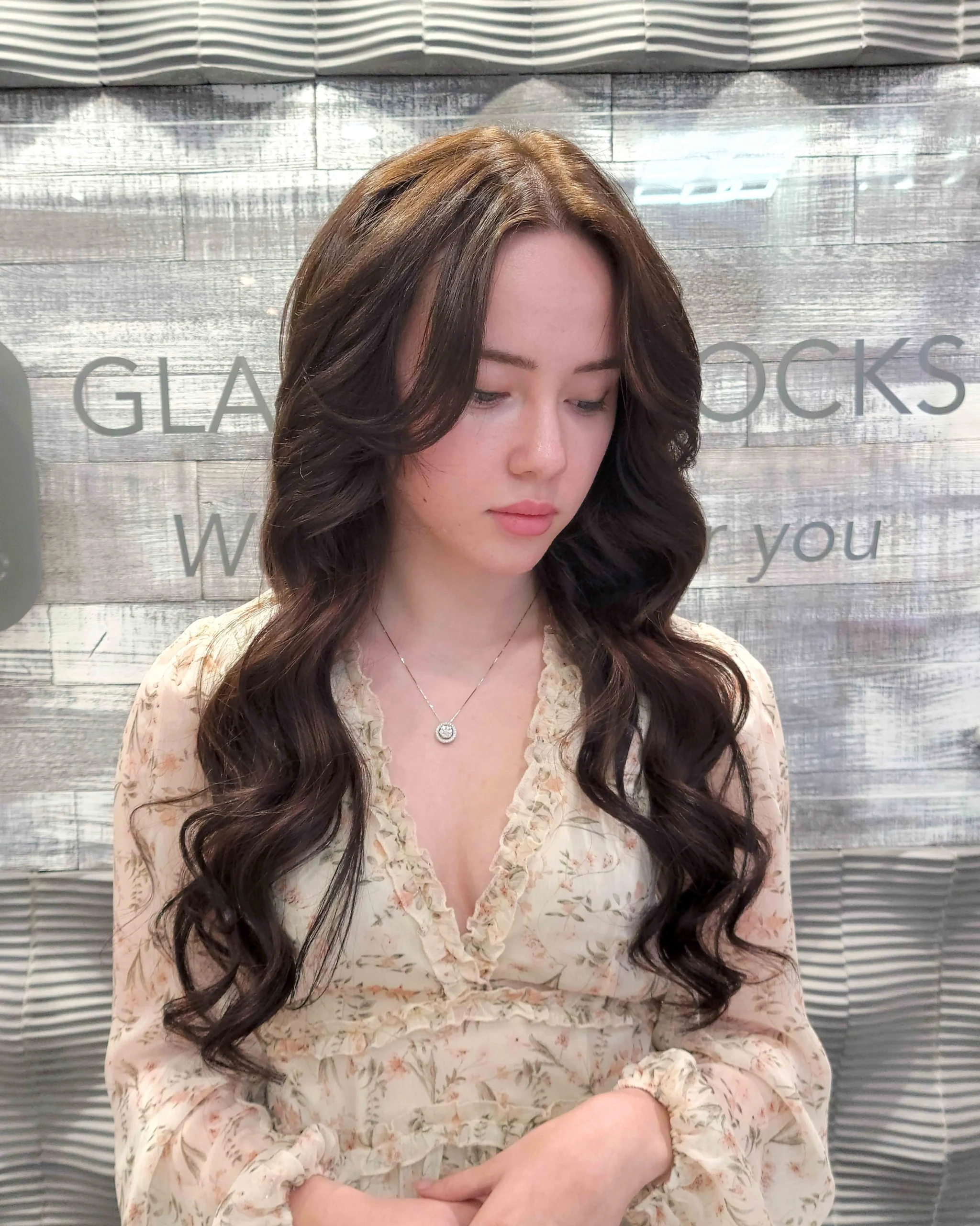 Before and after weft hair extensions showing transformation from short hair to long wavy length with natural blend